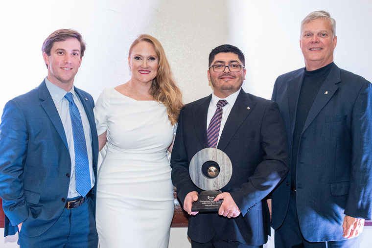 Recognition event · ANDRES team with crane-emblem award