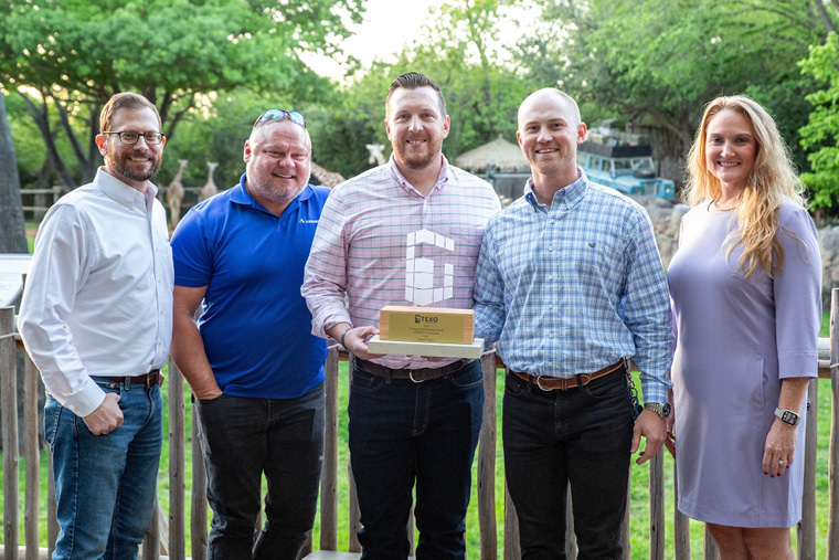 Outdoor team portrait · wooden award plaque