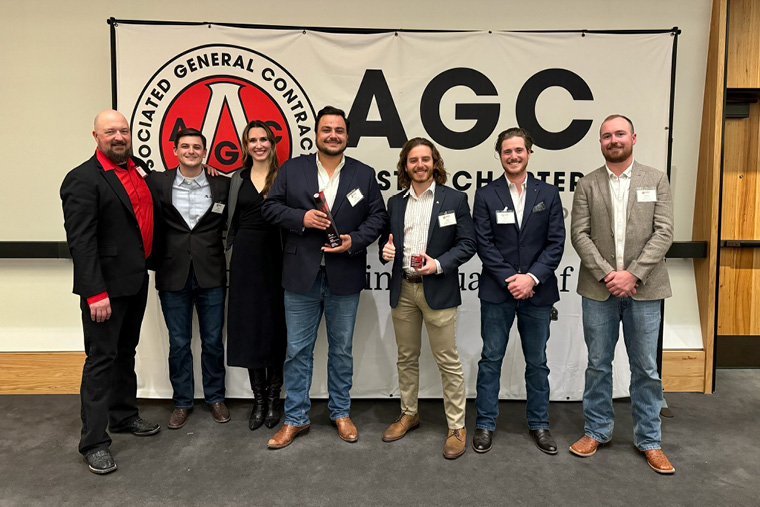 AGC banner · eight-person team portrait
